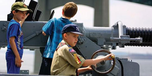 Kid at the Helm 500x250 - Battleship Cove - Fall River, MA
