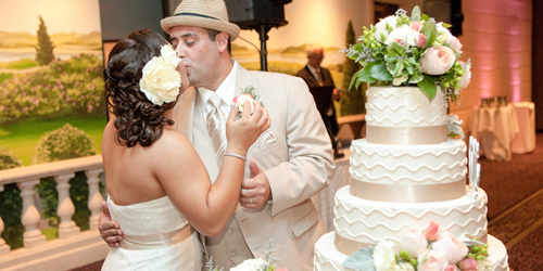 Wedding Cake & Kiss - Cape Codder Resort & Spa - Hyannis, MA - Credit Angela Greenlaw Photography