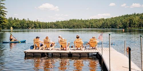 Relaxing on the Dock - Huttopia White Mountains - Albany, NH - Photo Credit Corey McMullen for Huttopia